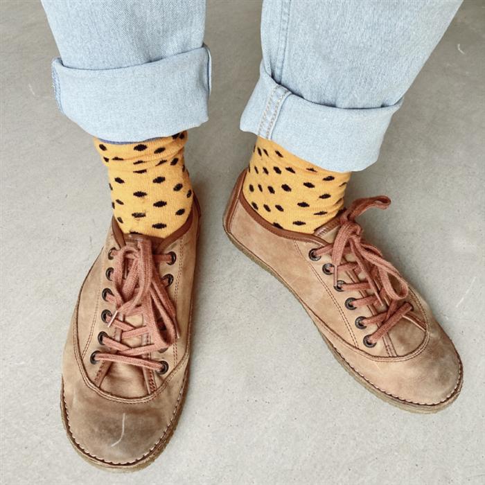 Leather sneakers with mustard polka-dot socks